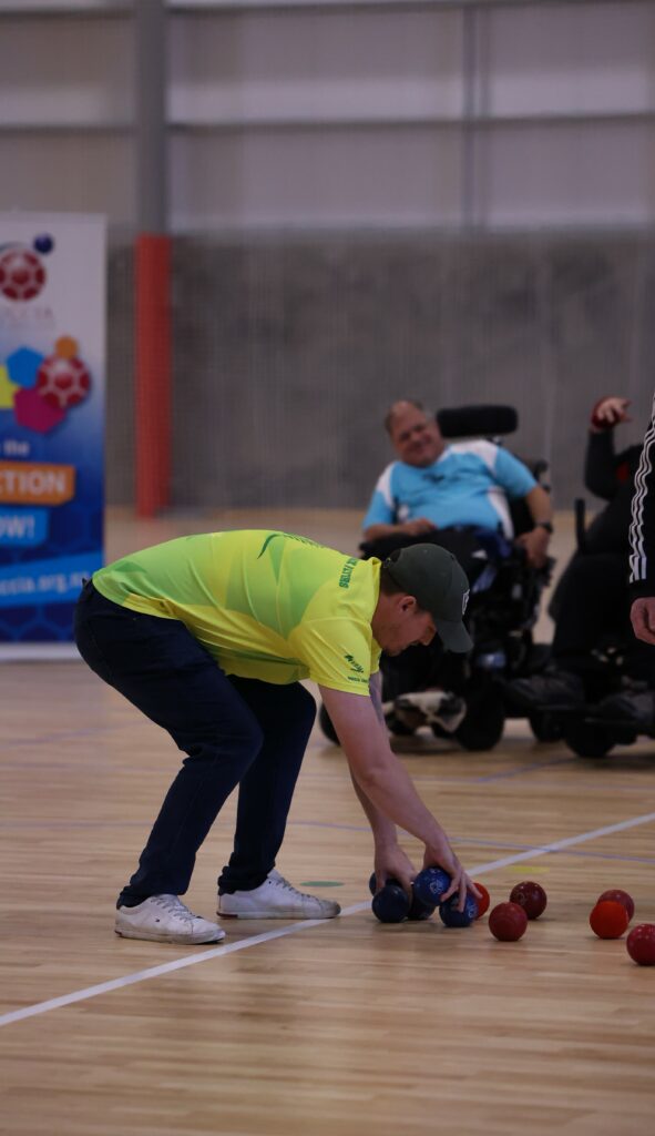 Community participation support in Sydney – inclusive boccia activity with support staff present